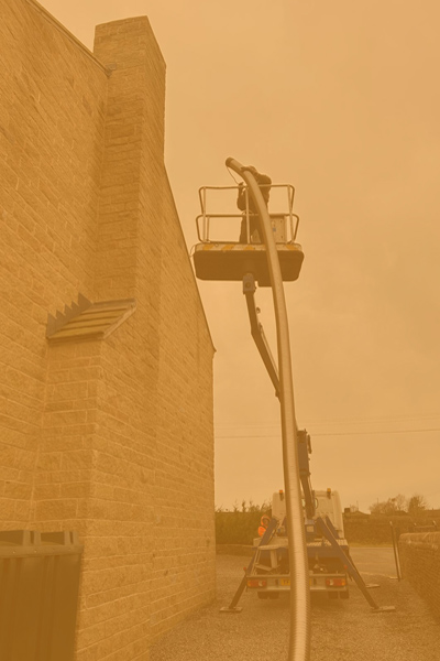Cherry Picker Installing Chimney Flue in West Yorkshire