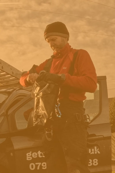 Height Done Right founder Giles Martin in climbing gear